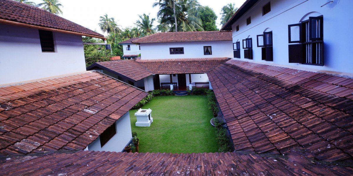 Paddy fields and green hills in Ayarkunnam, Kottayam — the setting of Kottathil Ayurveda Hospital, Kerala